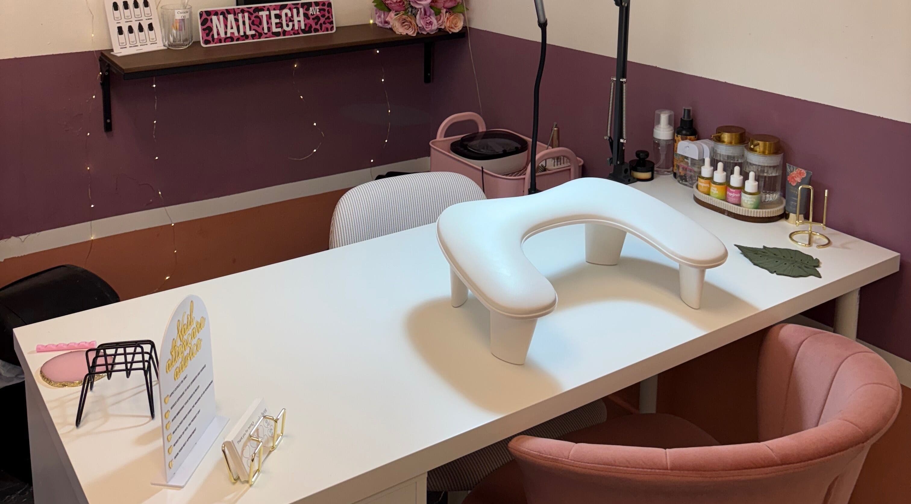 Chic nail station at Gels by Eleanor, Glasgow, Scotland, GB, featuring pink decor and nail products.