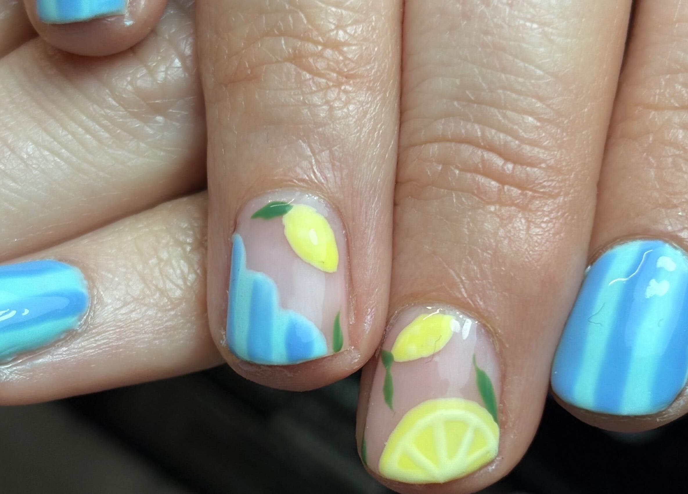 Lemon-themed nail art by Gels by Eleanor in Glasgow, Scotland, GB. Blue and yellow vibrant design.