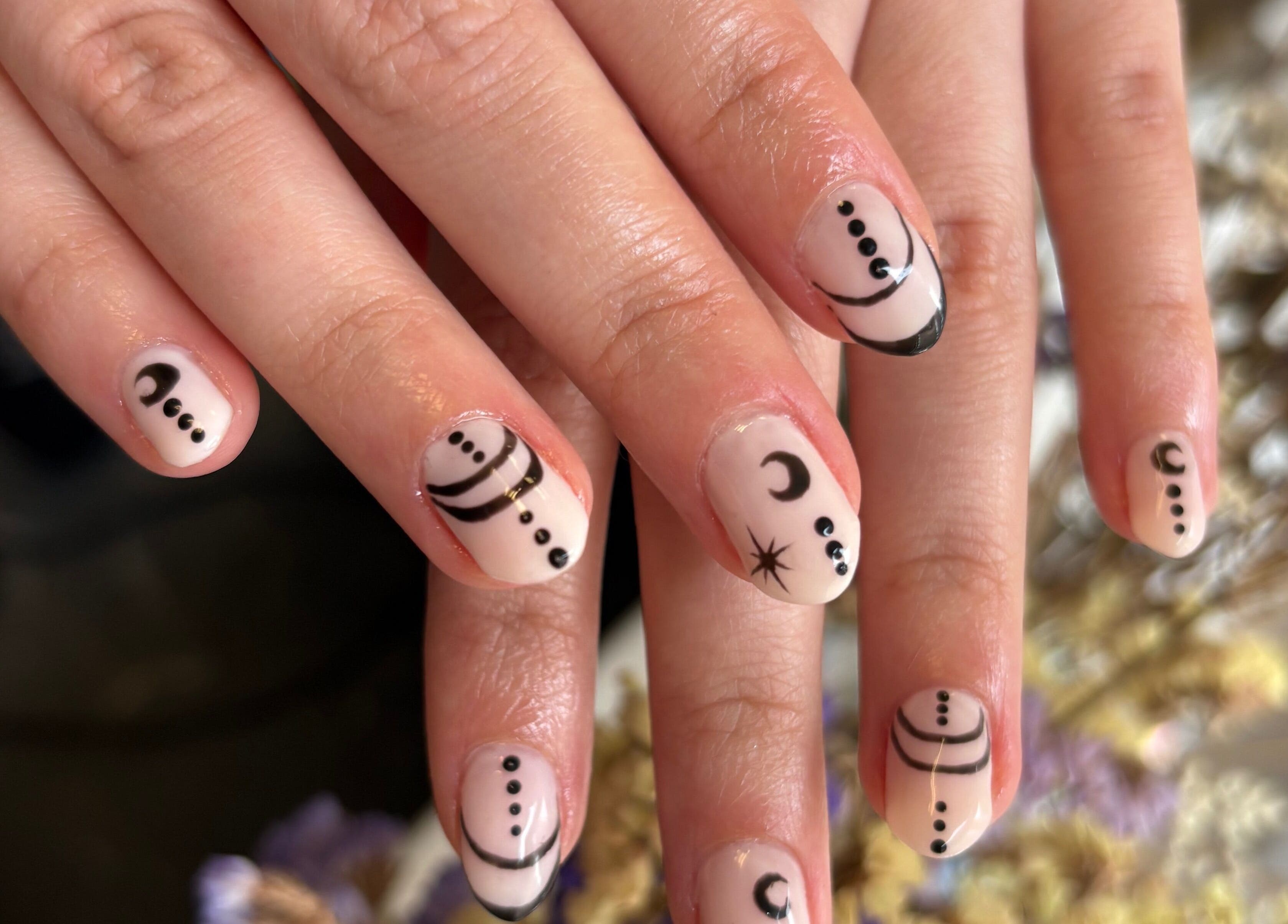 Intricate celestial-themed nail art at Gels by Eleanor in Glasgow, Scotland, GB.