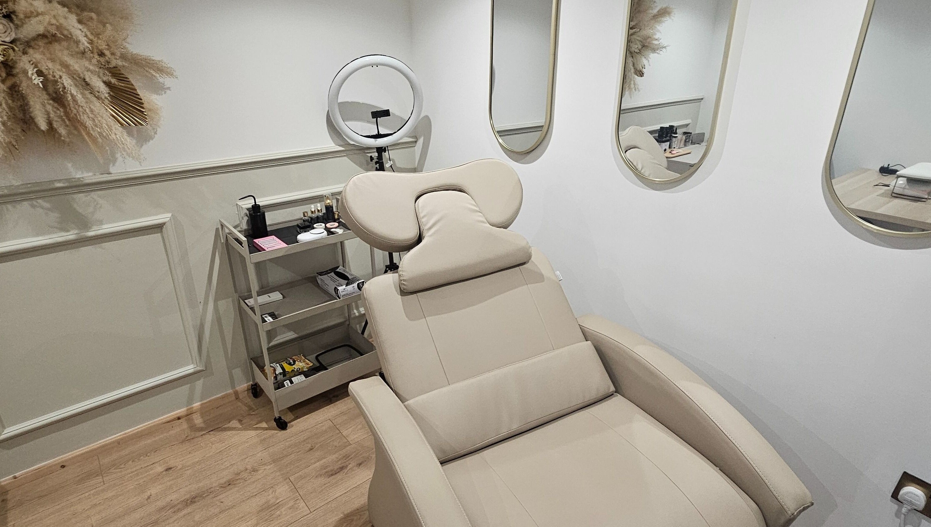 Luxurious treatment room at Glowgetter Beauty, Holmes Chapel, England, GB with sleek furnishings and decor.