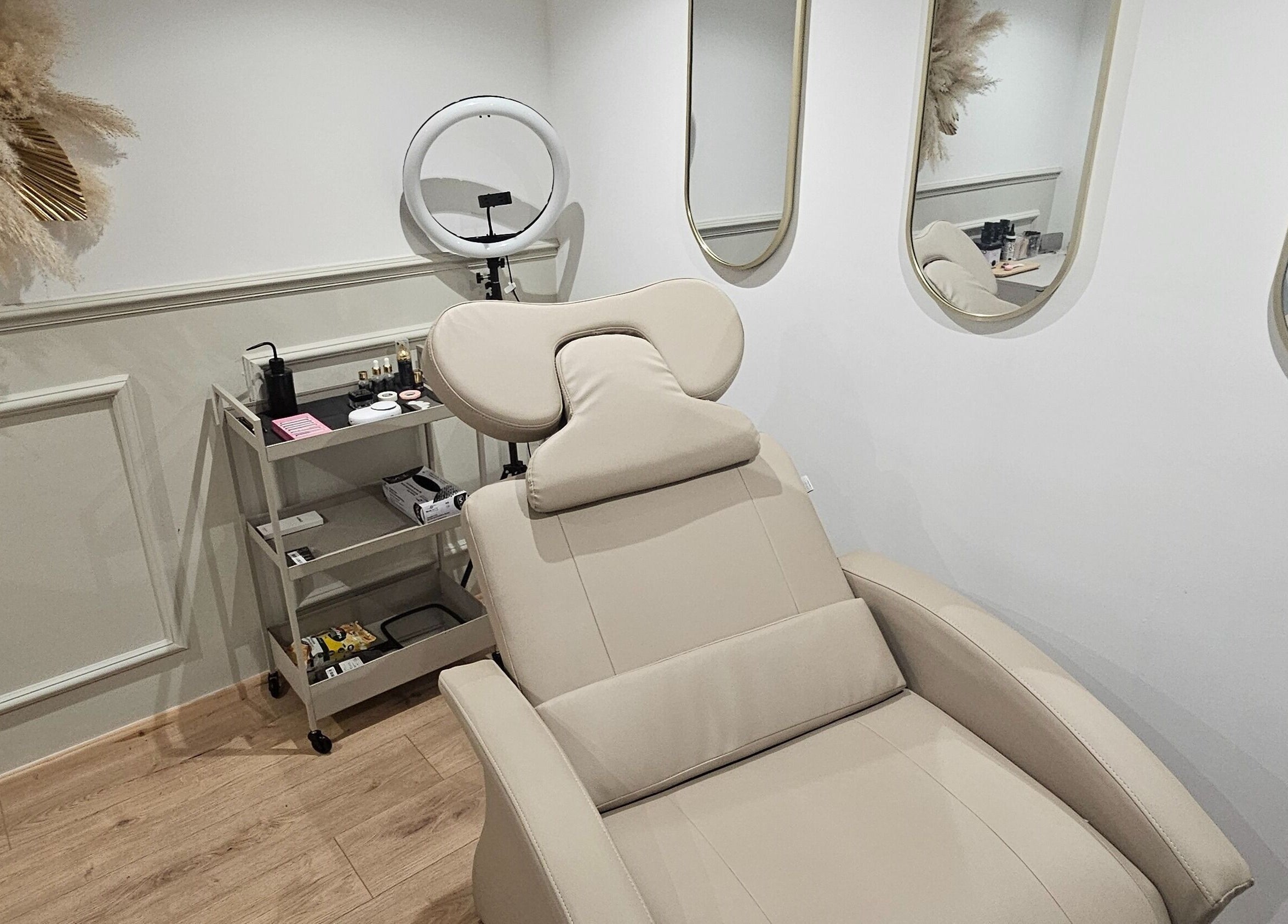 Luxurious treatment room at Glowgetter Beauty, Holmes Chapel, England, GB with sleek furnishings and decor.