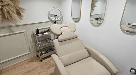 Luxurious treatment room at Glowgetter Beauty, Holmes Chapel, England, GB with sleek furnishings and decor.