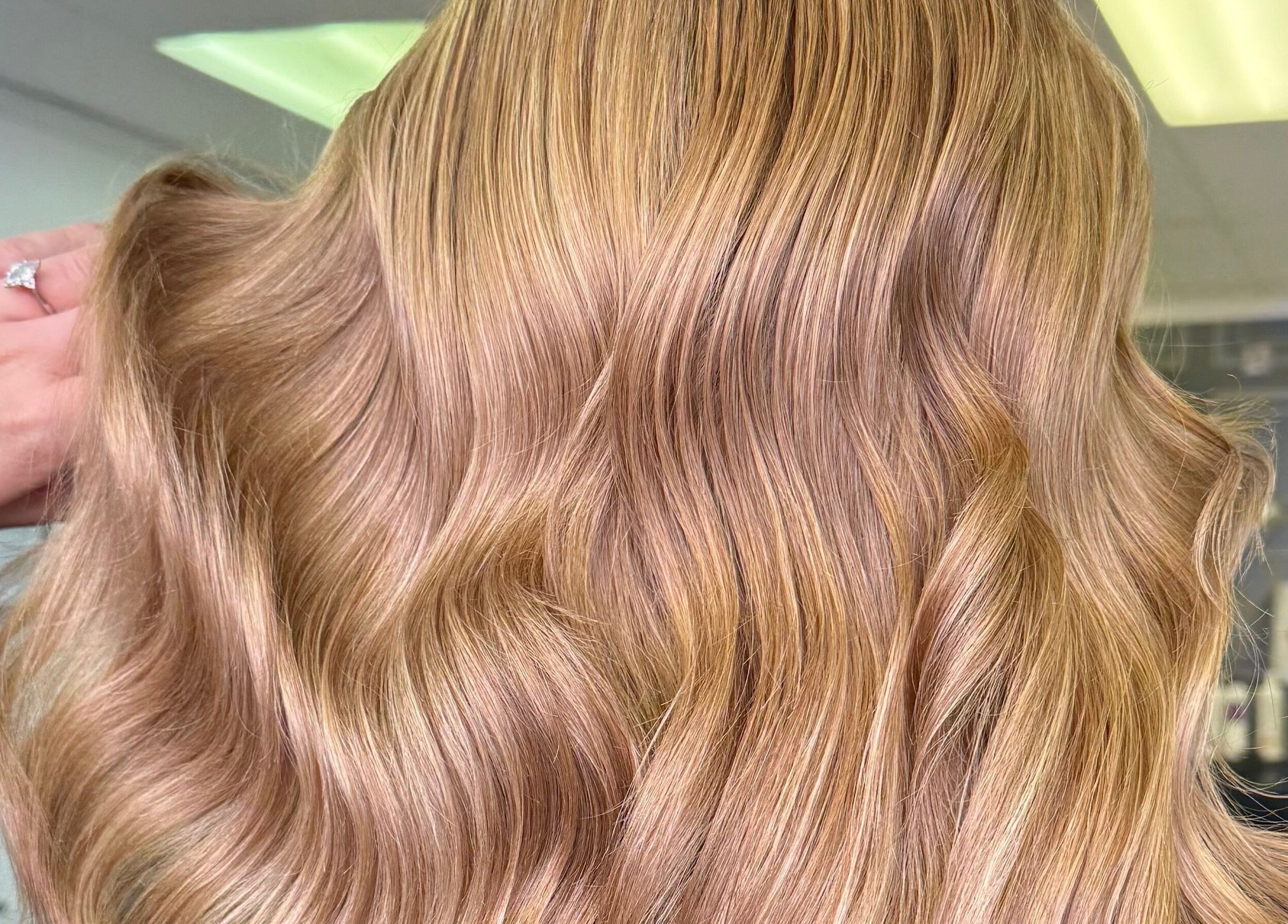 Elegant blonde waves styled at Lucy Rose Hair in Smethwick, England, GB.