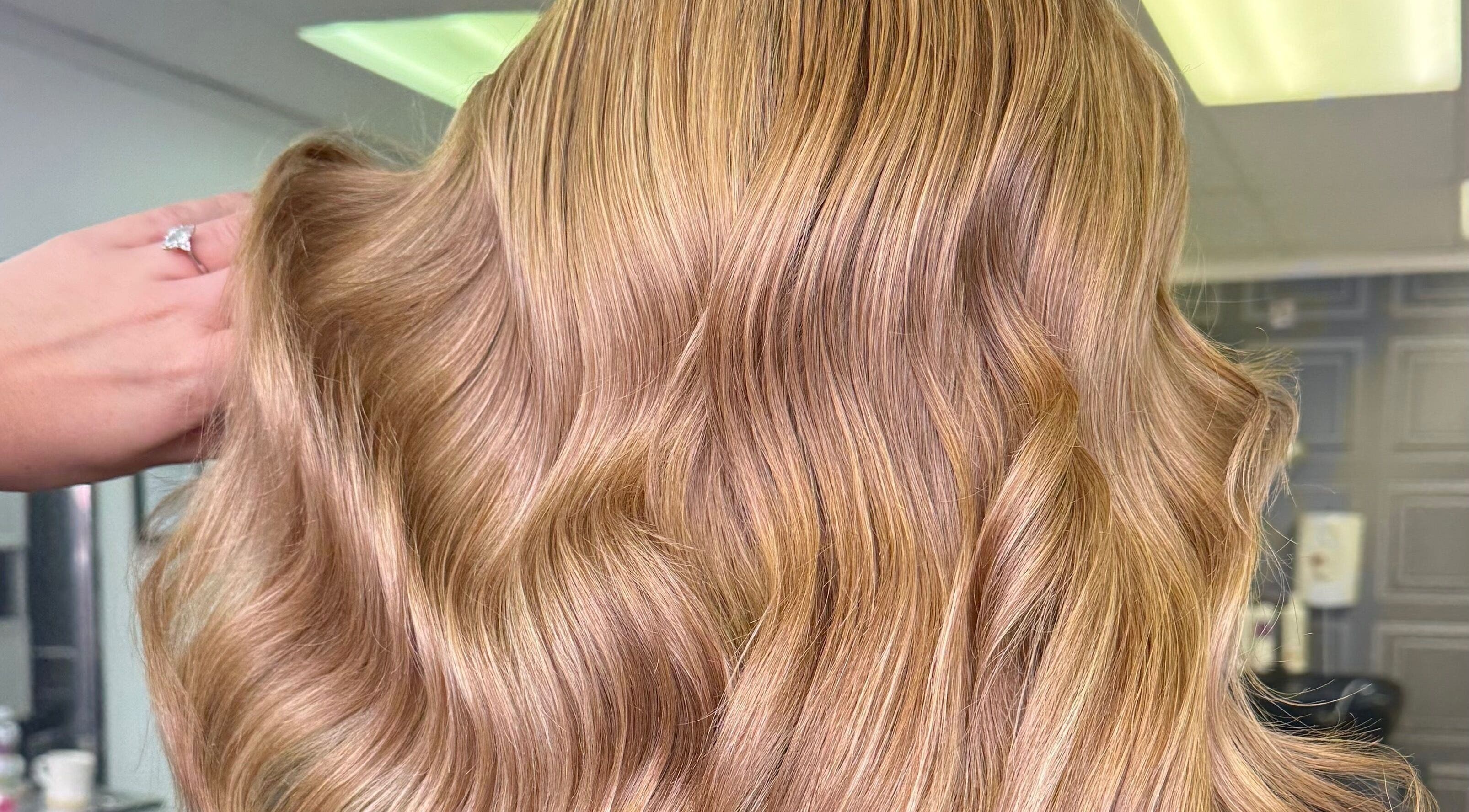 Elegant blonde waves styled at Lucy Rose Hair in Smethwick, England, GB.