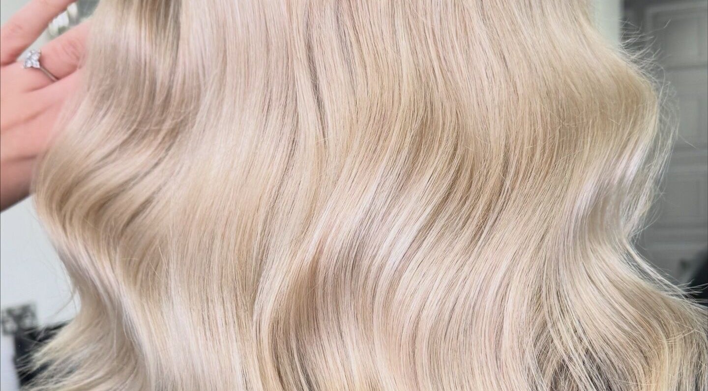 Blonde wavy hair styled at Lucy Rose Hair, Smethwick, England, GB showcasing vibrant shine.