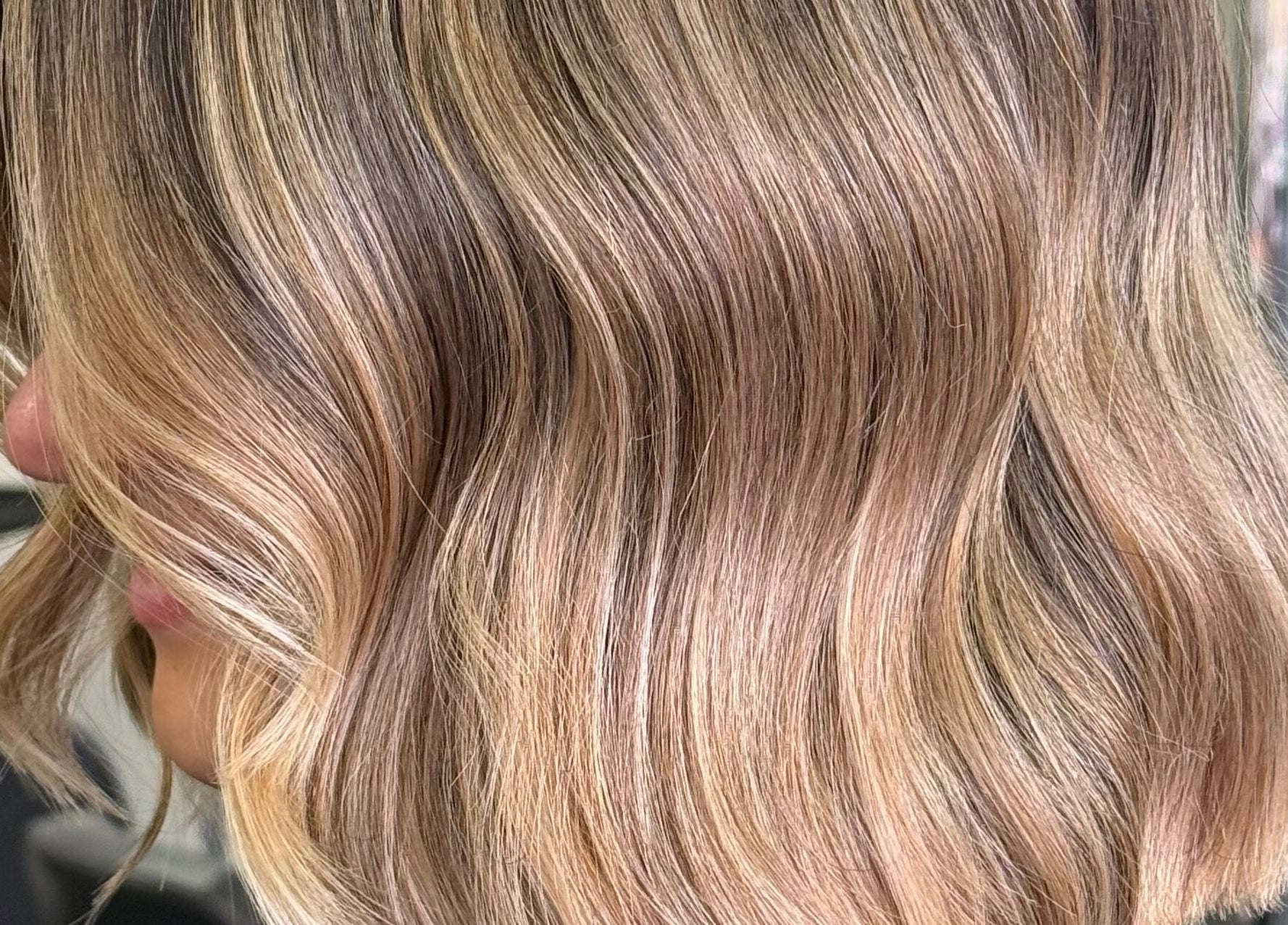 Blonde wavy hair styled at Lucy rose hair, Smethwick, England, GB for a vibrant look.