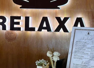 Elegant Relaxa Wellness Spa sign and menu in City Of Iriga, Bicol, PH, offering premium services.