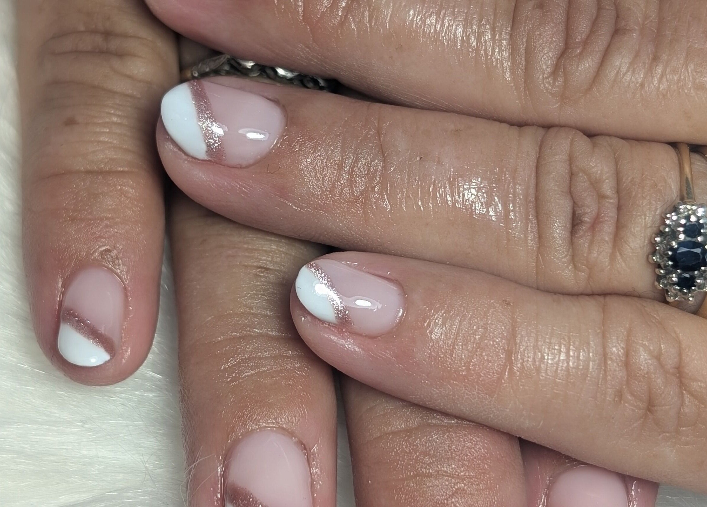 Stylish nail art with white accents at Peaceful Polish, Burry Port, Wales, GB.
