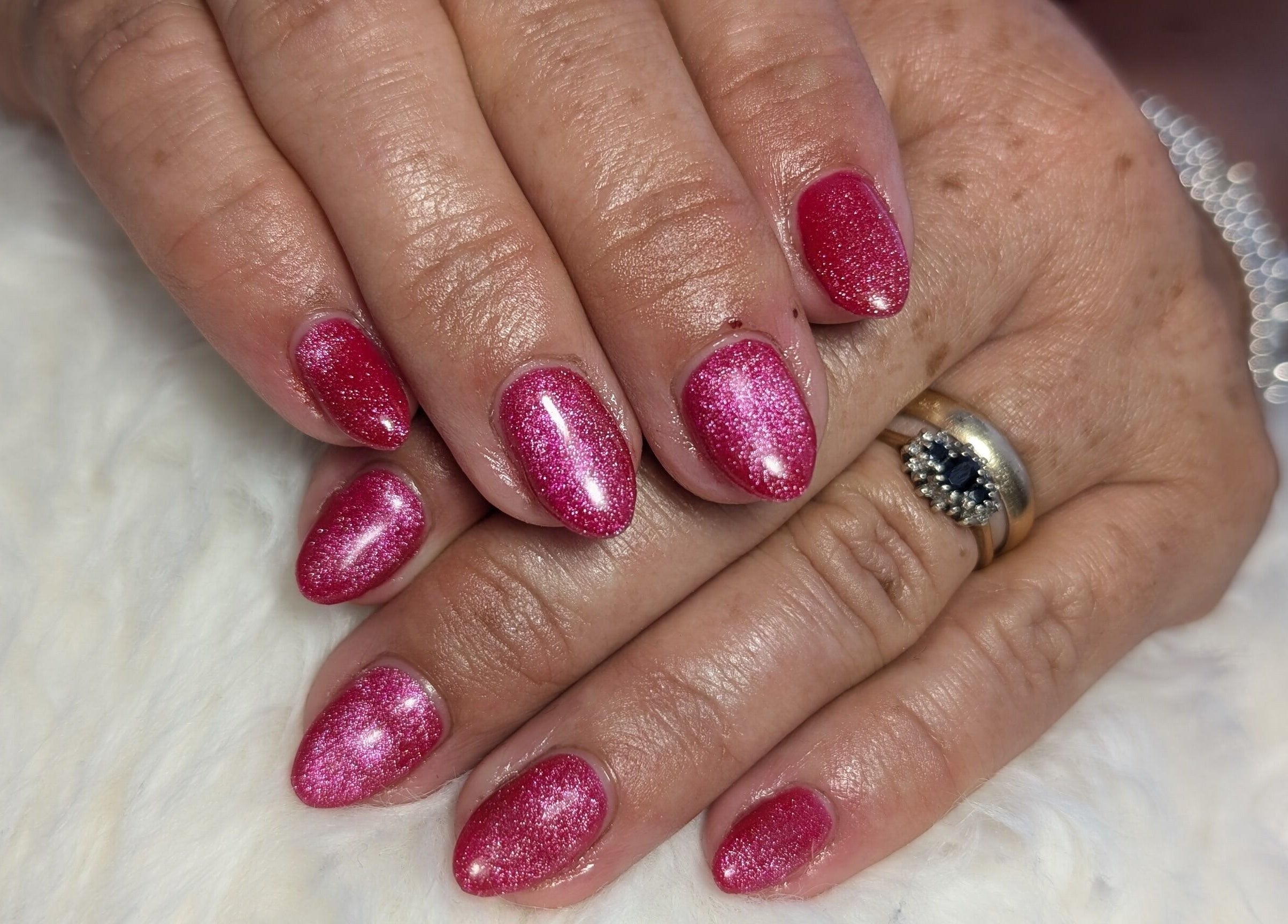 Shimmering pink nails from Peaceful Polish in Burry Port, Wales, GB showcasing expert nail artistry.