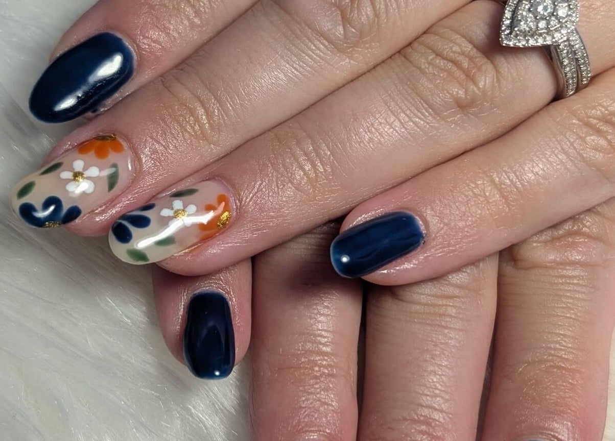 Elegant floral nail art at Peaceful Polish, Burry Port, Wales, GB. Dazzling blue and flower designs.