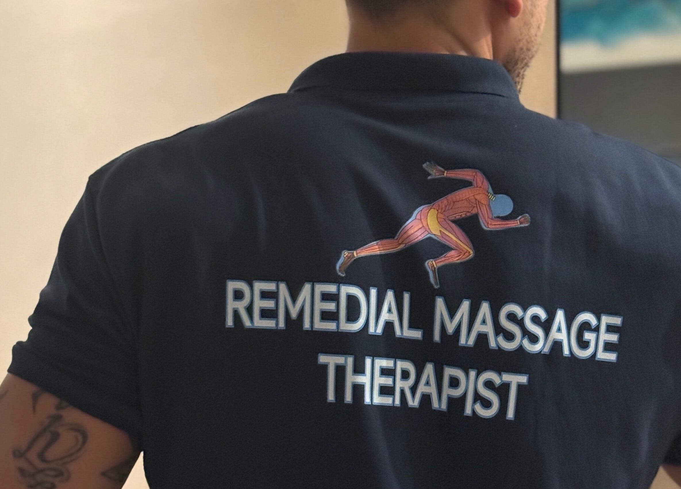 Remedial Massage Therapist shirt at clinic in BGC, PH.