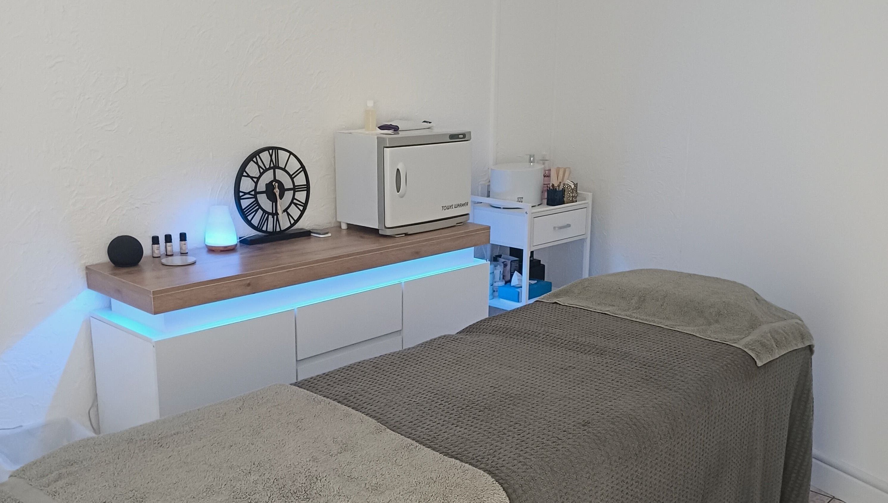 Calming treatment room at Sapphire Beauty, Lowestoft, England, GB featuring a massage table and soothing decor.