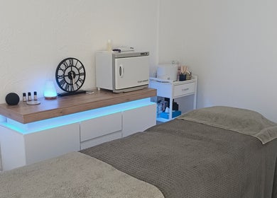 Calming treatment room at Sapphire Beauty, Lowestoft, England, GB featuring a massage table and soothing decor.