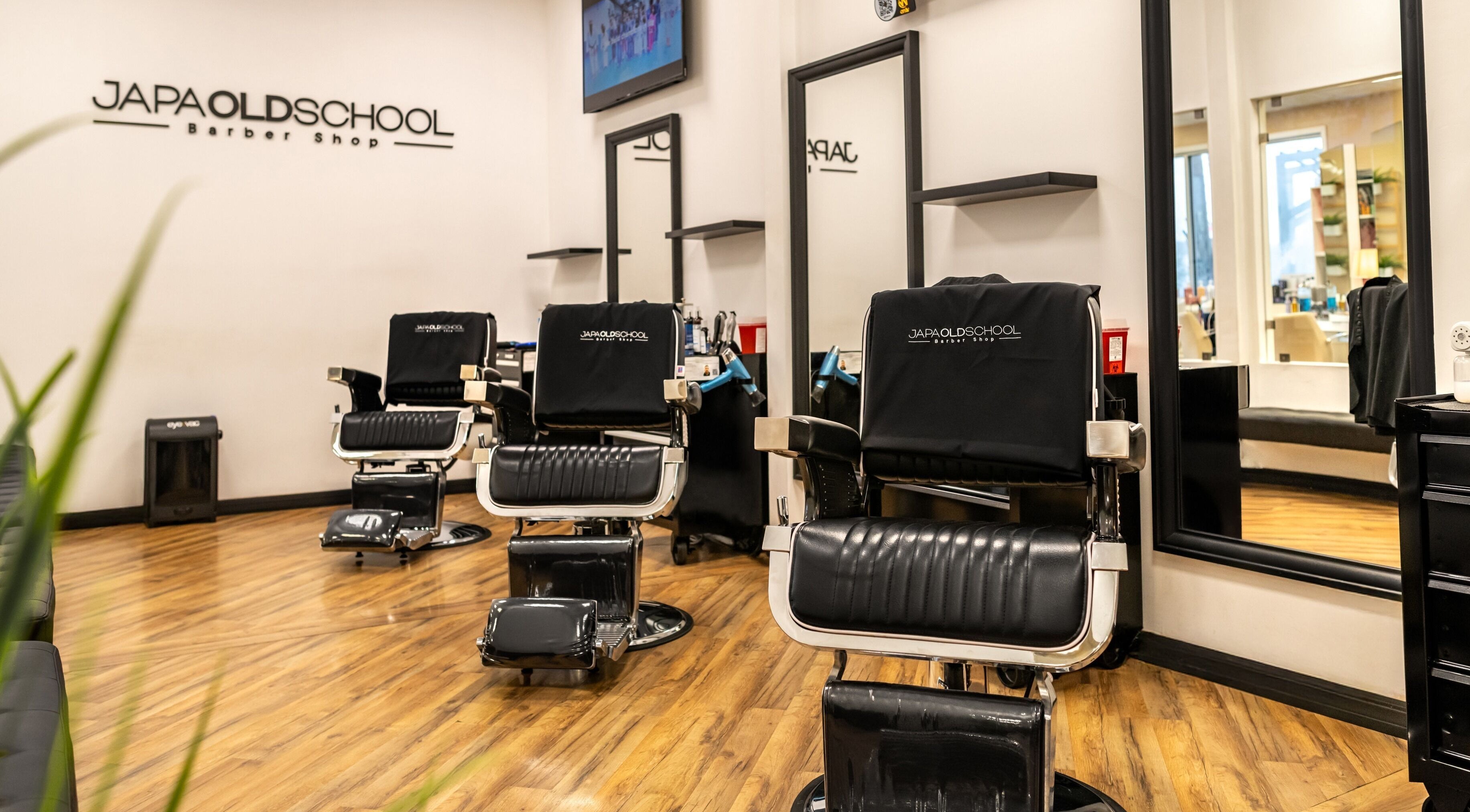 Interior view of Japa Old School Barbershop Windermere, showcasing stylish barber chairs in Windermere, Florida, US.