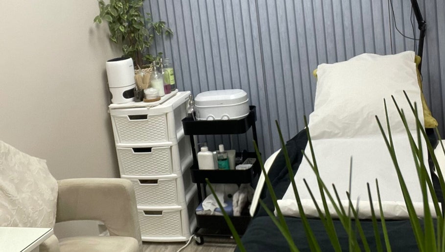 Beauteous treatment room with massage bed and products in Southampton, England, GB ready for a relaxing session.