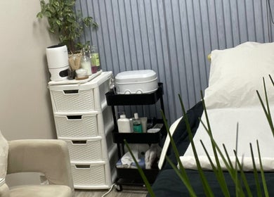 Beauteous treatment room with massage bed and products in Southampton, England, GB ready for a relaxing session.