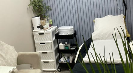 Beauteous treatment room with massage bed and products in Southampton, England, GB ready for a relaxing session.