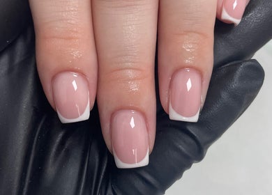 Chic French manicure at Beauteous salon, Southampton, England, GB. Elegant nail art with flawless finish.