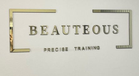 Elegant gold signage of Beauteous in Southampton, England, GB showcasing precise training services.