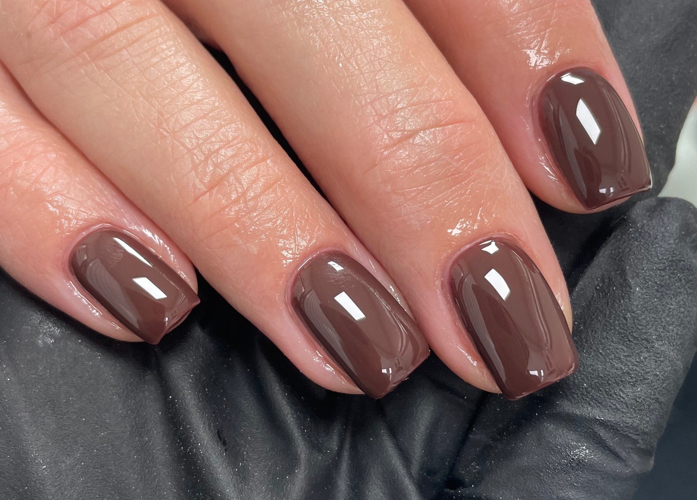 Elegant glossy mocha manicure at Beauteous in Southampton, England, GB, perfect for a stylish look.