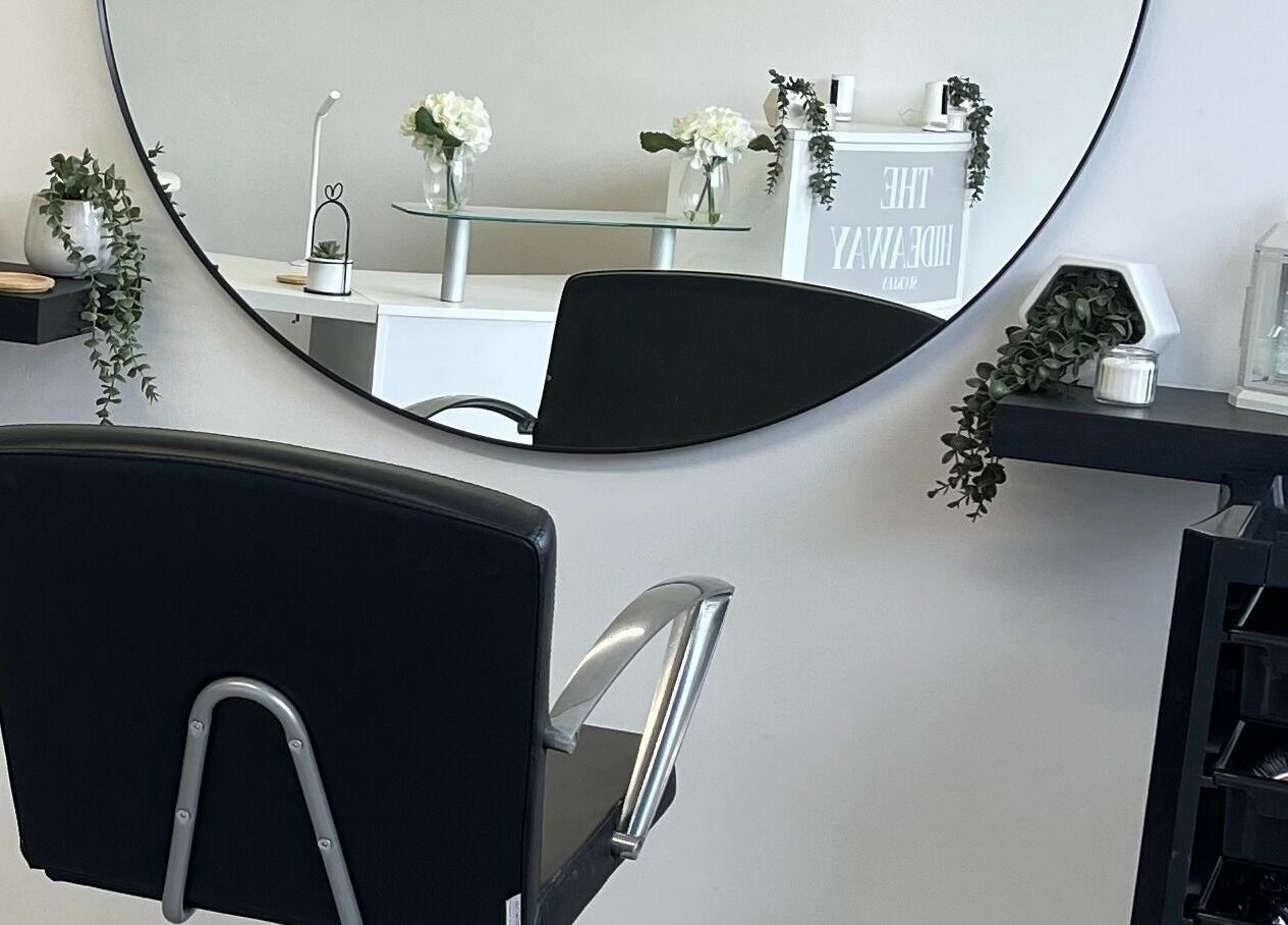 Stylish salon chair and elegant decor at The Hideaway Salon, Malvern, England, GB.