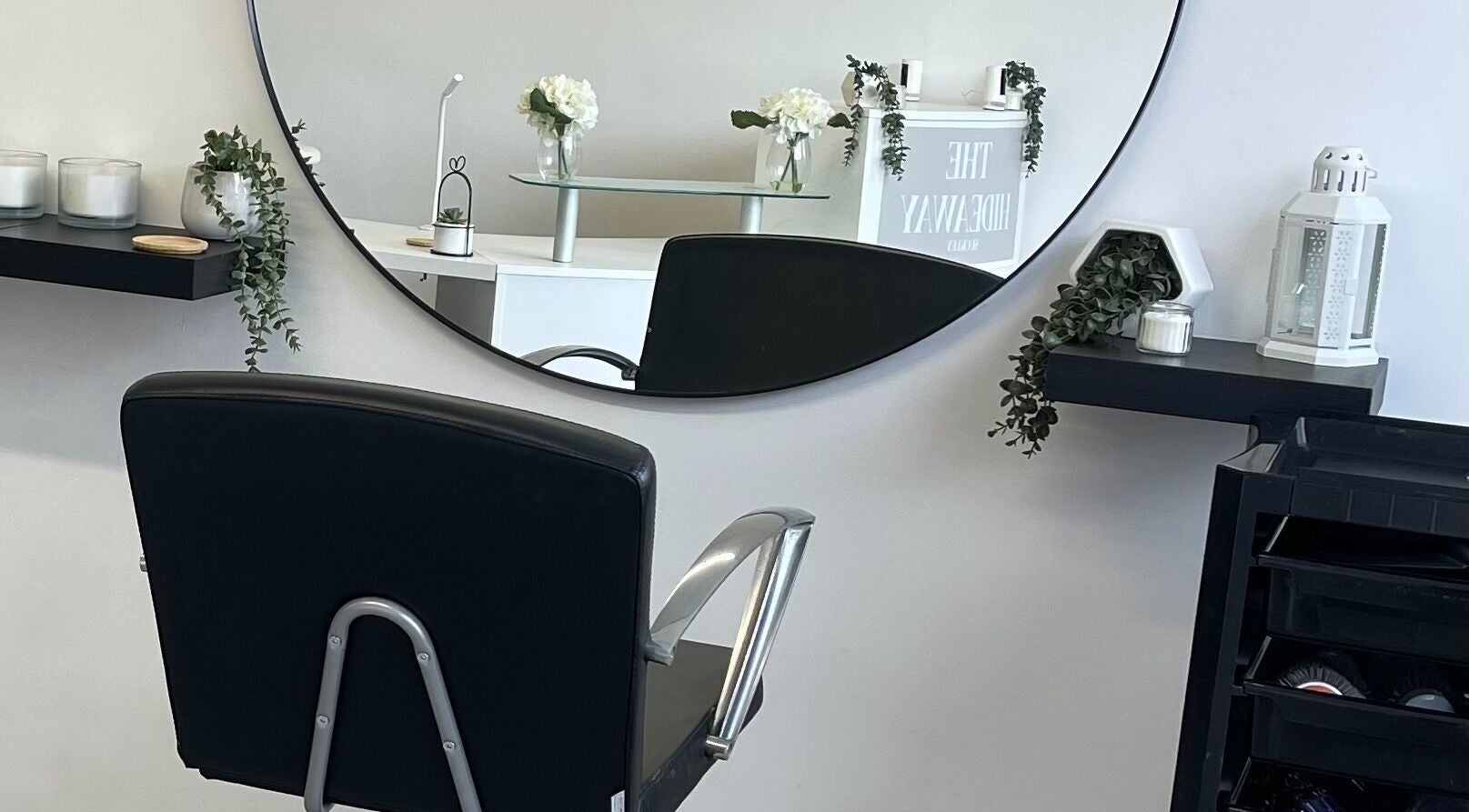 Stylish salon chair and elegant decor at The Hideaway Salon, Malvern, England, GB.