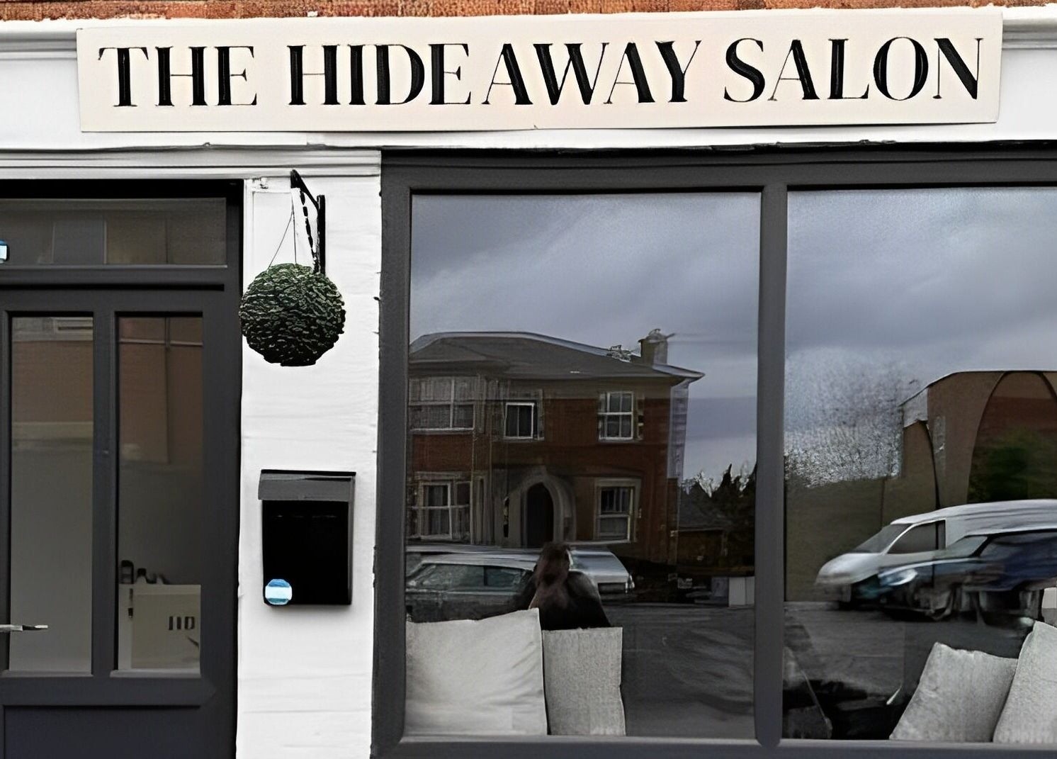 Front view of The Hideaway Salon in Malvern, England, GB, showcasing a modern exterior.
