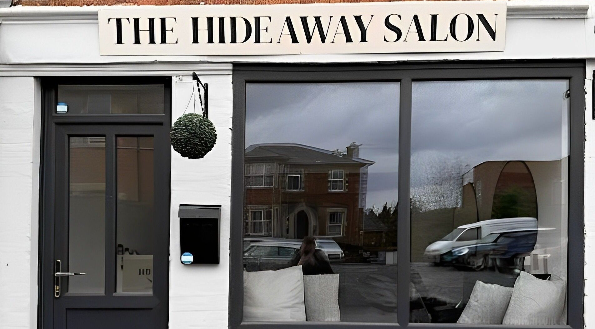 Front view of The Hideaway Salon in Malvern, England, GB, showcasing a modern exterior.