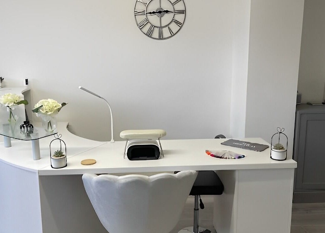 Elegant nail station at The Hideaway Salon, Malvern, England, GB, featuring flowers and a modern setup.