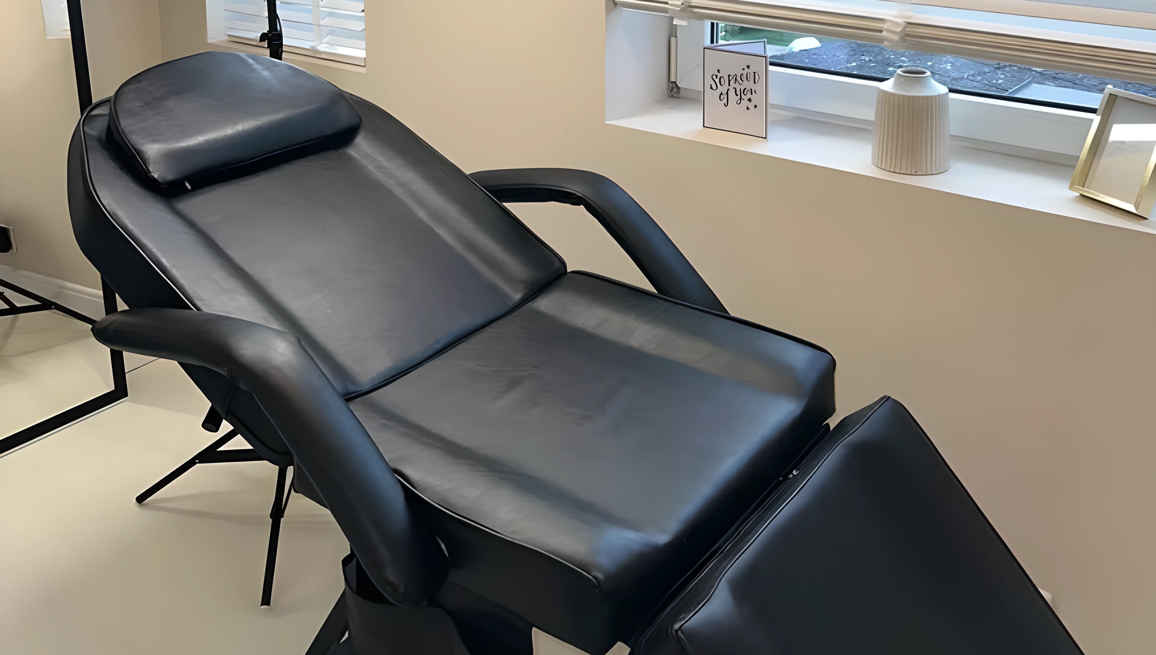 Luxury treatment chair at Caits Beauty Spot in Barry, GB, offering premium comfort and style.