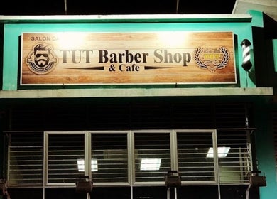 Exterior of Leecutshair barbershop in Petaling Jaya, Selangor, MY featuring a prominent wooden sign.