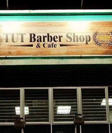 Exterior of Leecutshair barbershop in Petaling Jaya, Selangor, MY featuring a prominent wooden sign.