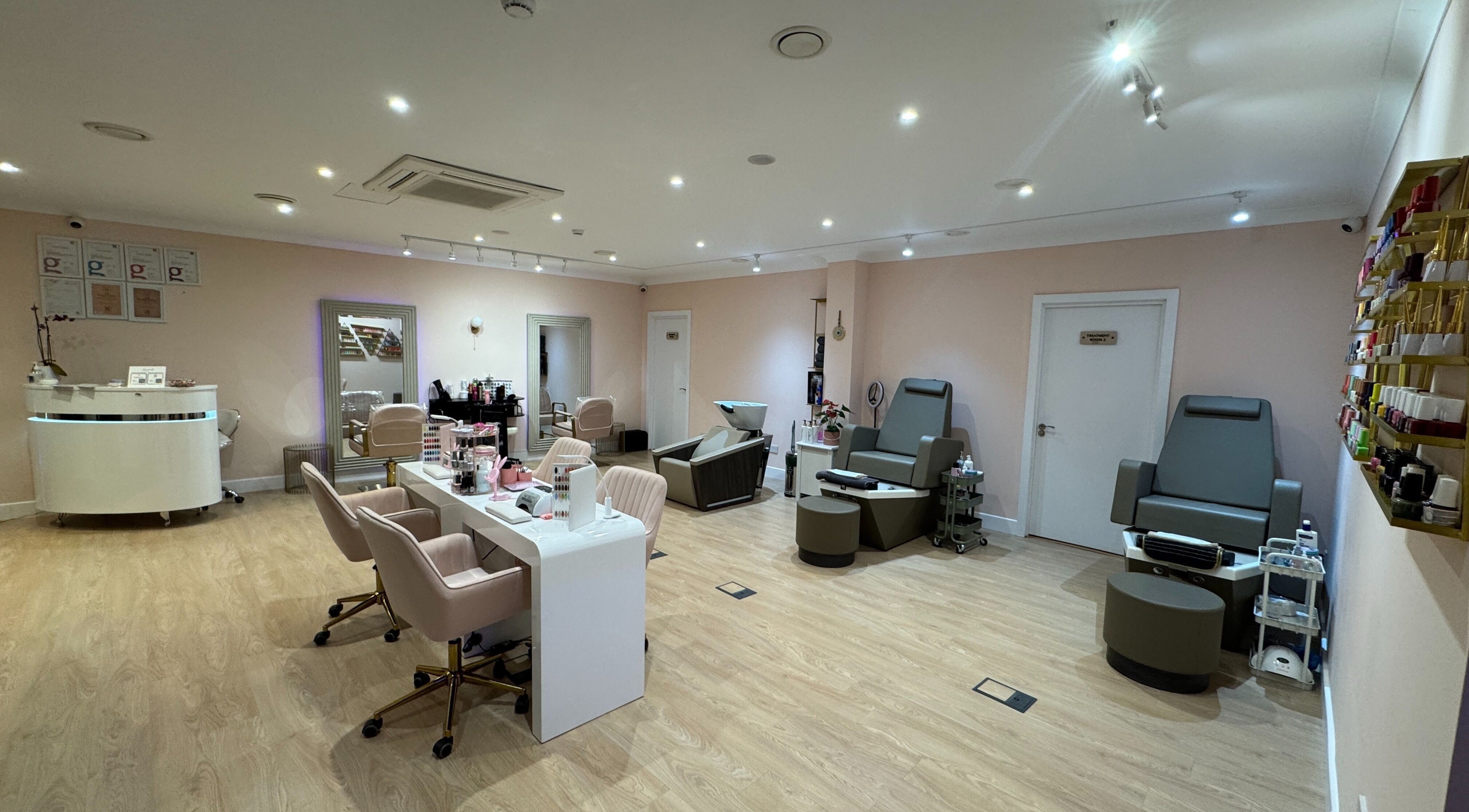 Interior of Hampstead Medspa, London, England, GB featuring pedicure chairs and manicure stations.