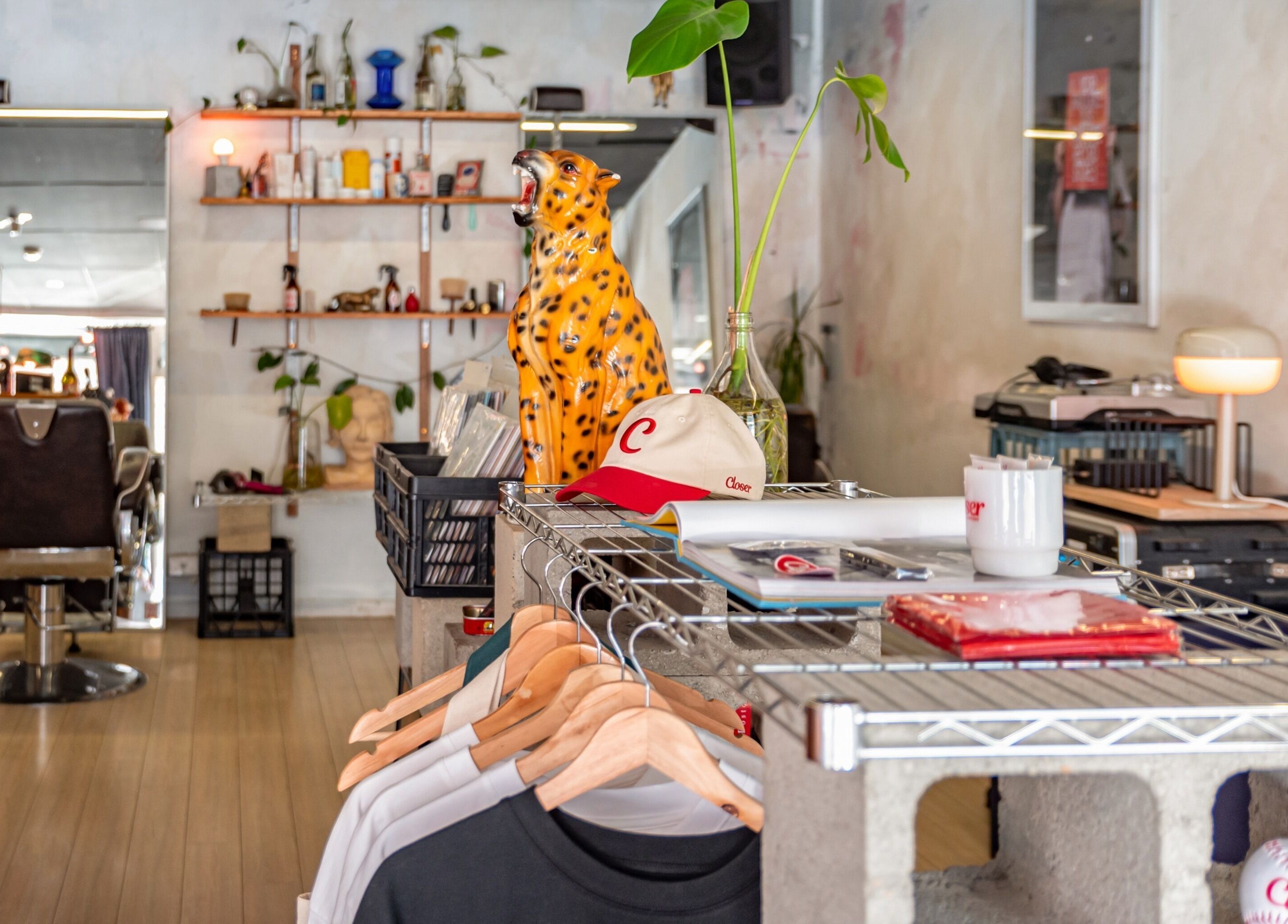 The Royal Moody in Glenelg, South Australia, AU features a chic barber chair with stylish decor and modern ambiance.