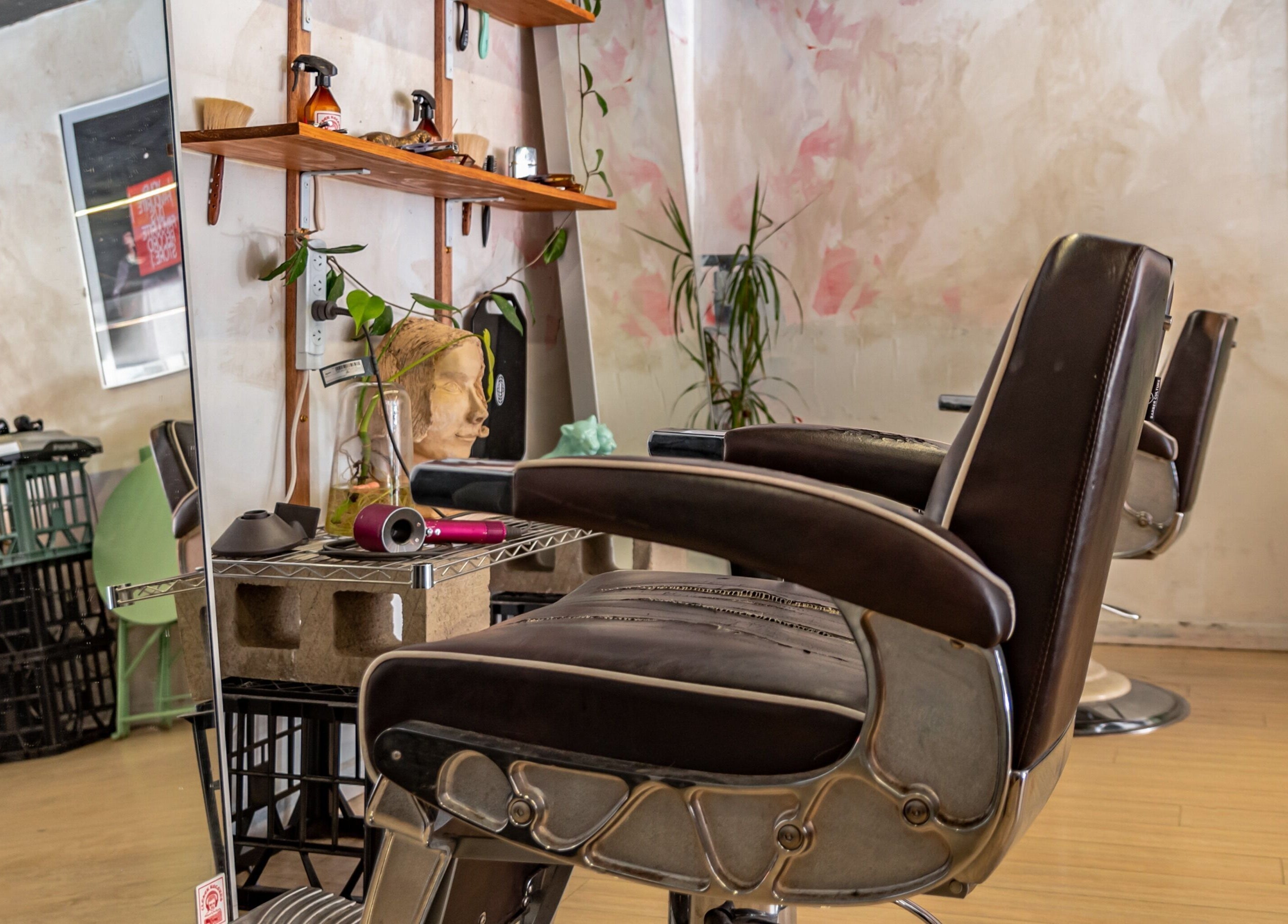 Elegant salon setup at The Royal Moody, Glenelg, South Australia, AU showcasing stylish chairs and decor.