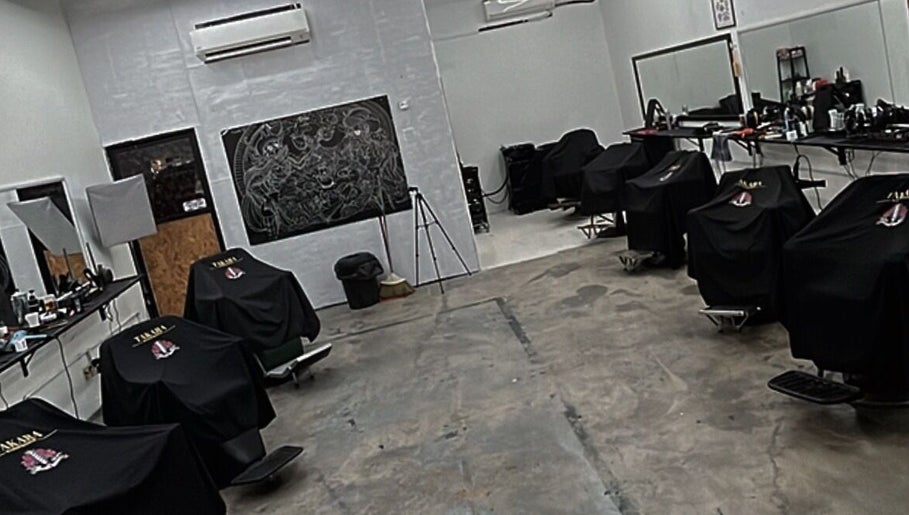 Interior of TAKARA BARBERSHOP in Puncak Alam, Selangor, MY showcasing modern chairs and mirrors.