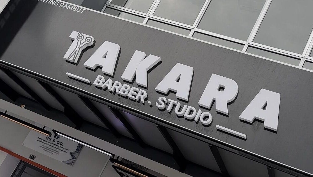 Takara Barbershop entrance in Puncak Alam, Selangor, MY showcasing sleek signage.