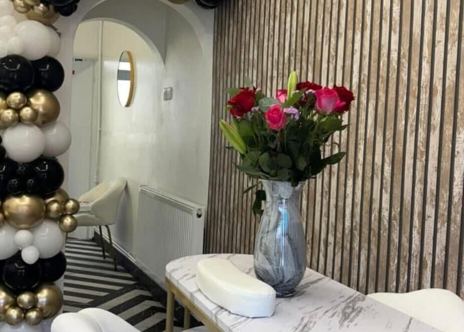 Stylish interior of T H Nails in Barnsley, England, GB with floral and balloon decor.