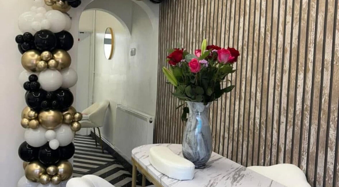 Stylish interior of T H Nails in Barnsley, England, GB with floral and balloon decor.