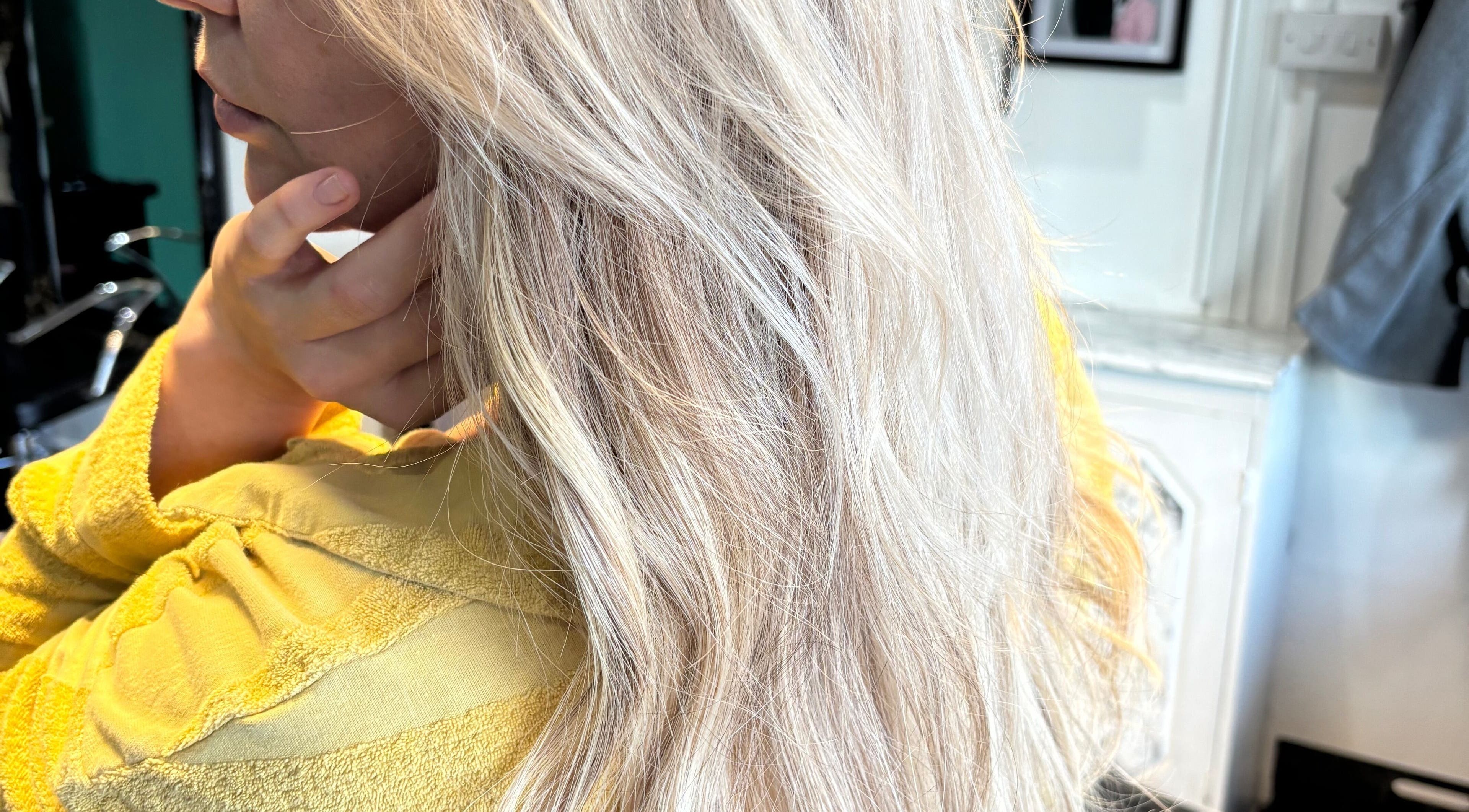 Blonde hair styled in waves at Arran & Emily Hair, Bury, England, GB salon.