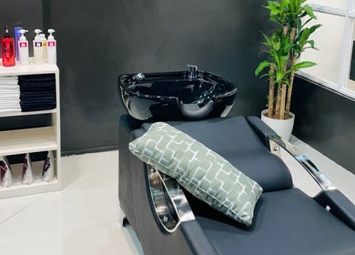 Stylish wash station at Nima Hair By Japanese in Parañaque, Metro Manila, PH, with sleek black basin.