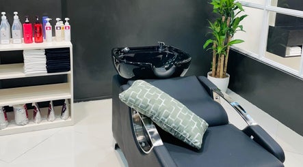 Stylish wash station at Nima Hair By Japanese in Parañaque, Metro Manila, PH, with sleek black basin.