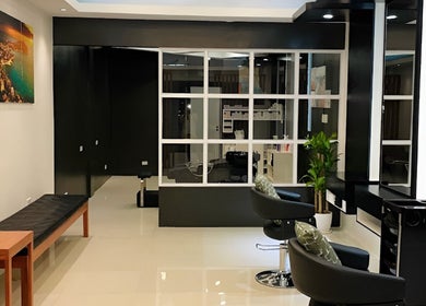 Interior view of Nima Hair By Japanese, Parañaque, Metro Manila, PH. Modern chairs and sleek design.