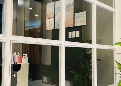 Modern salon interior at Nima Hair By Japanese, Parañaque, Metro Manila, PH with stylish decor and plants.