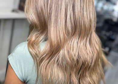 Stylish blonde hair waves at Hair by Chelsea, Clydebank, Scotland, GB.
