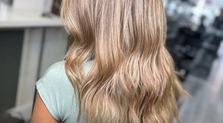 Stylish blonde hair waves at Hair by Chelsea, Clydebank, Scotland, GB.