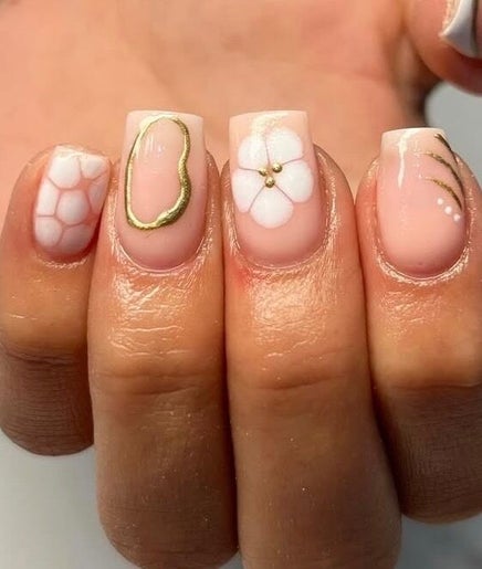 Stylish manicure with floral and gold designs at Izzy’s beauty room 🤍, Gorseinon, Wales, GB.