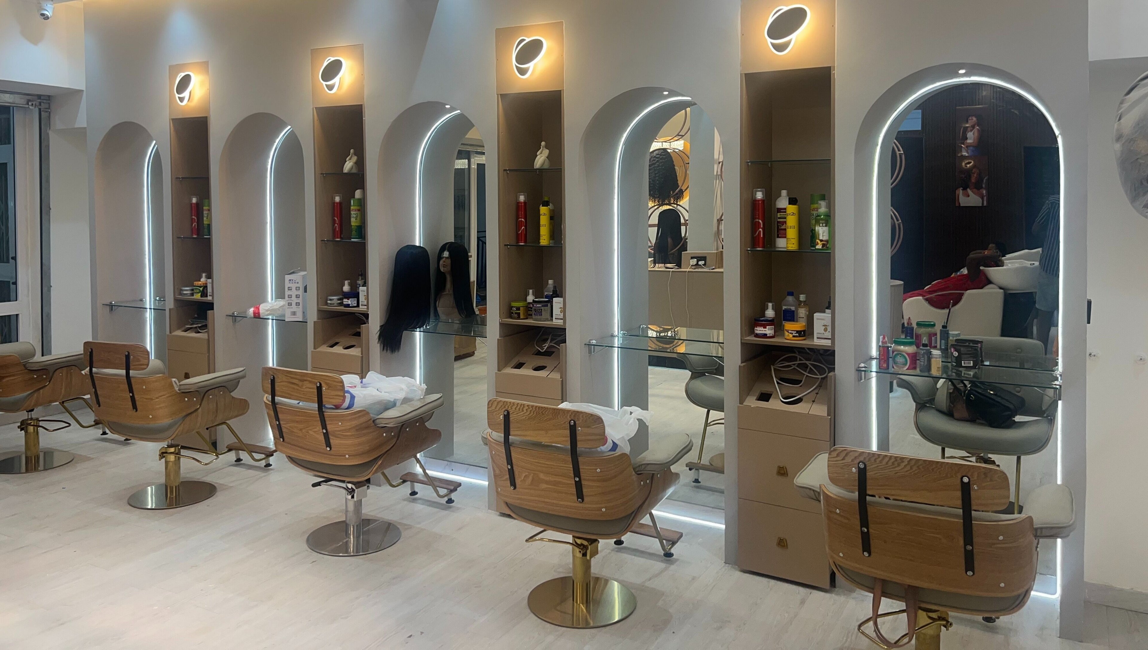 Elegant styling chairs and illuminated mirrors at Wighub & Salon, Accra, Greater Accra Region, GH.