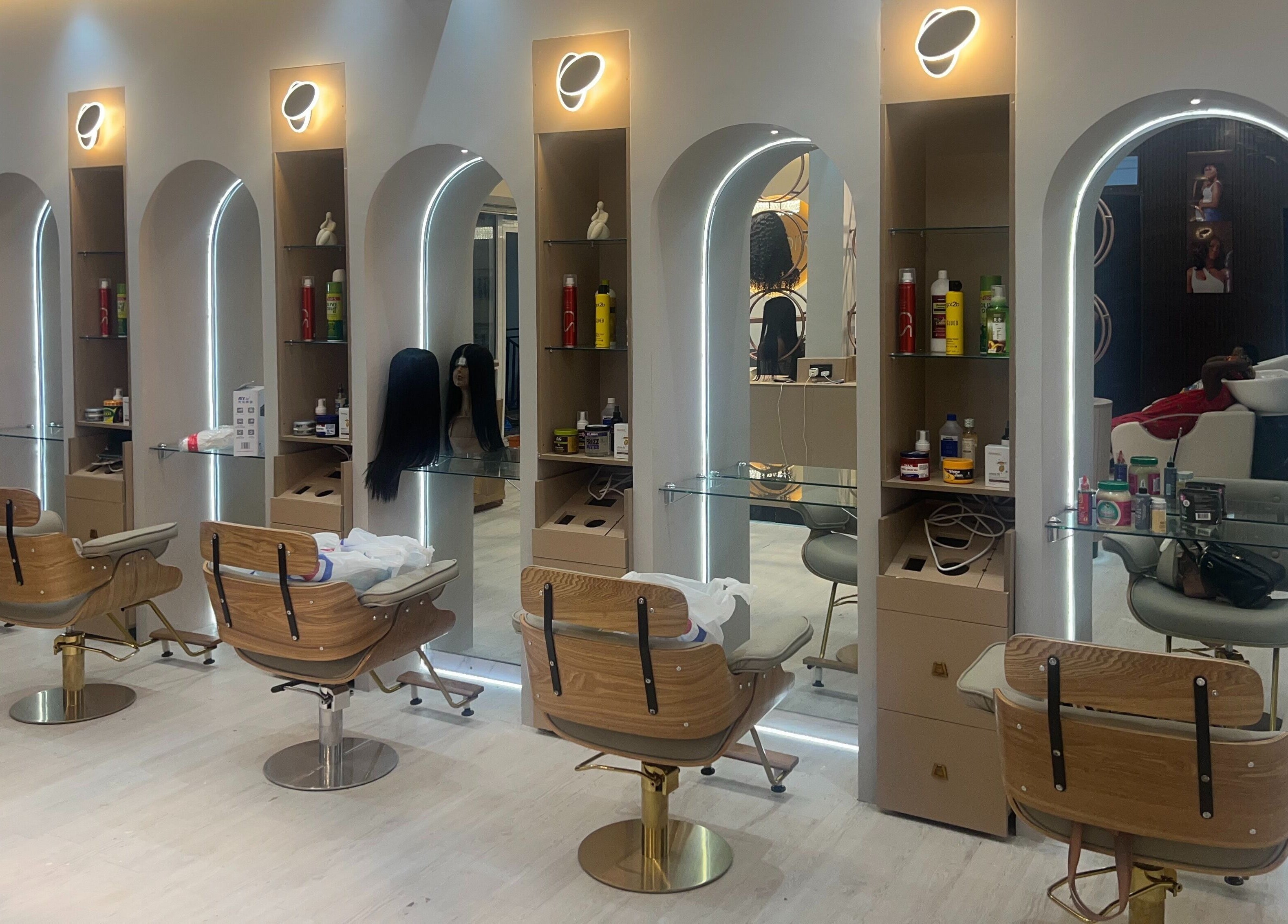 Elegant styling chairs and illuminated mirrors at Wighub & Salon, Accra, Greater Accra Region, GH.