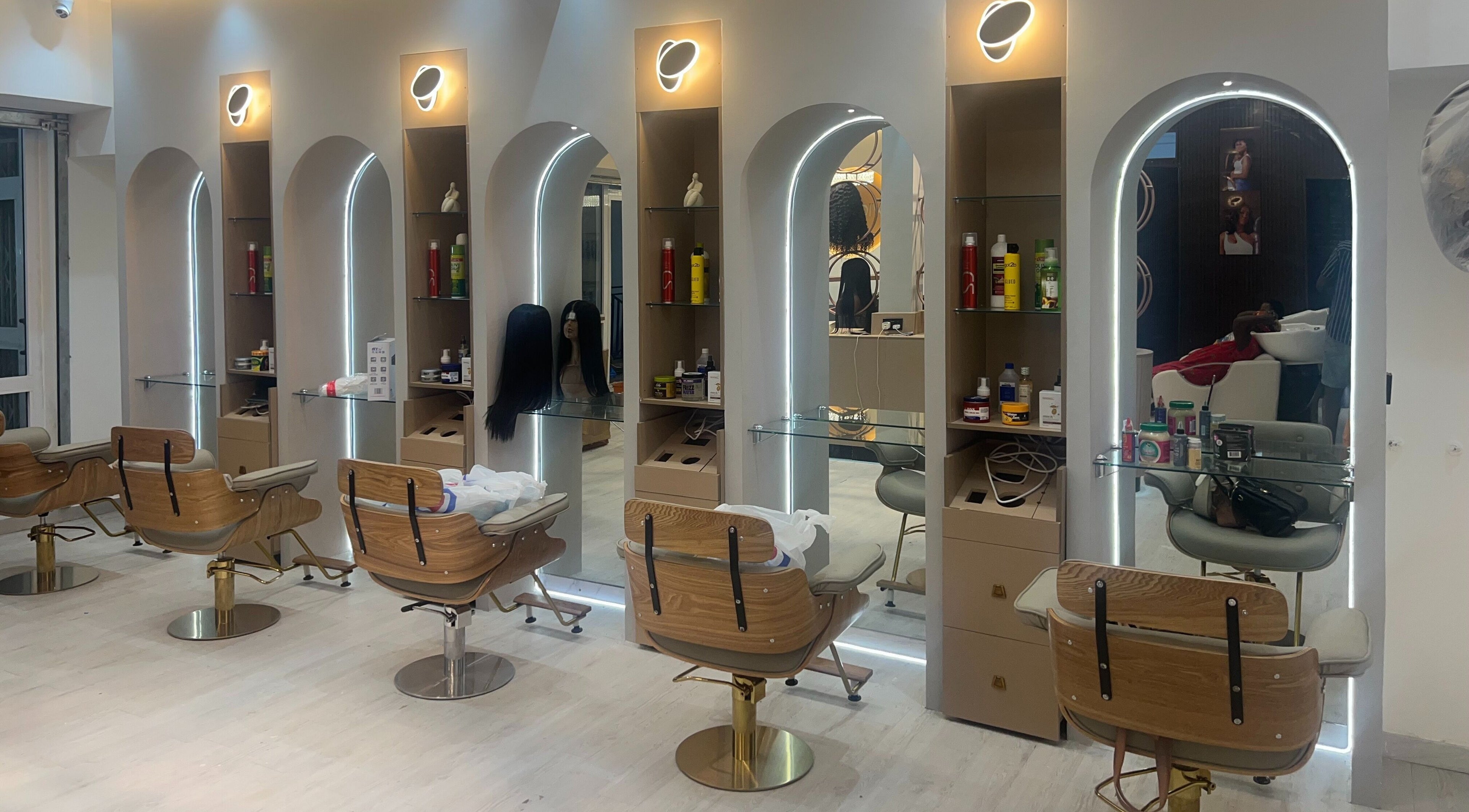 Elegant styling chairs and illuminated mirrors at Wighub & Salon, Accra, Greater Accra Region, GH.
